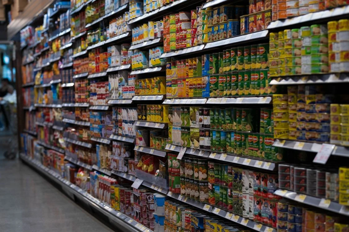 Packaged FMCG goods stocked on supermarket shelves